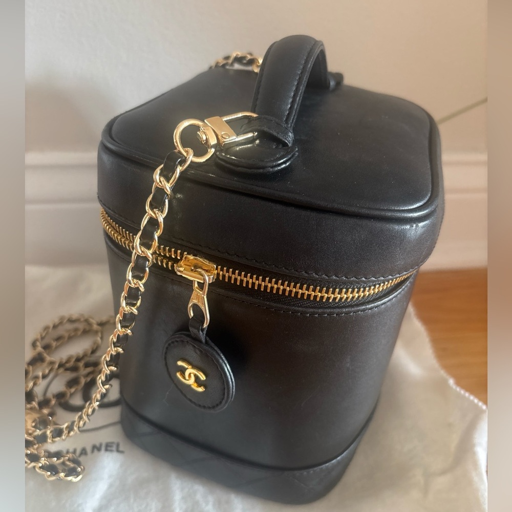 Authentic Chanel vanity case/bag in lambskin with chain